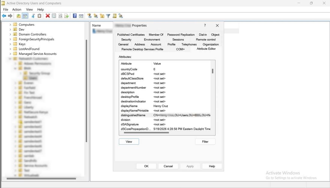 Active Directory Users and Computers - Attribute Editor showing the distinguishedName attribute